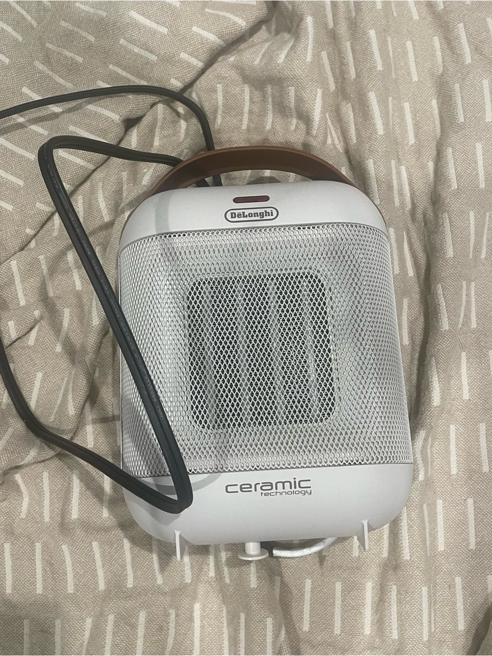 DeLonghi White Ceramic Space Heater with Carry Handle